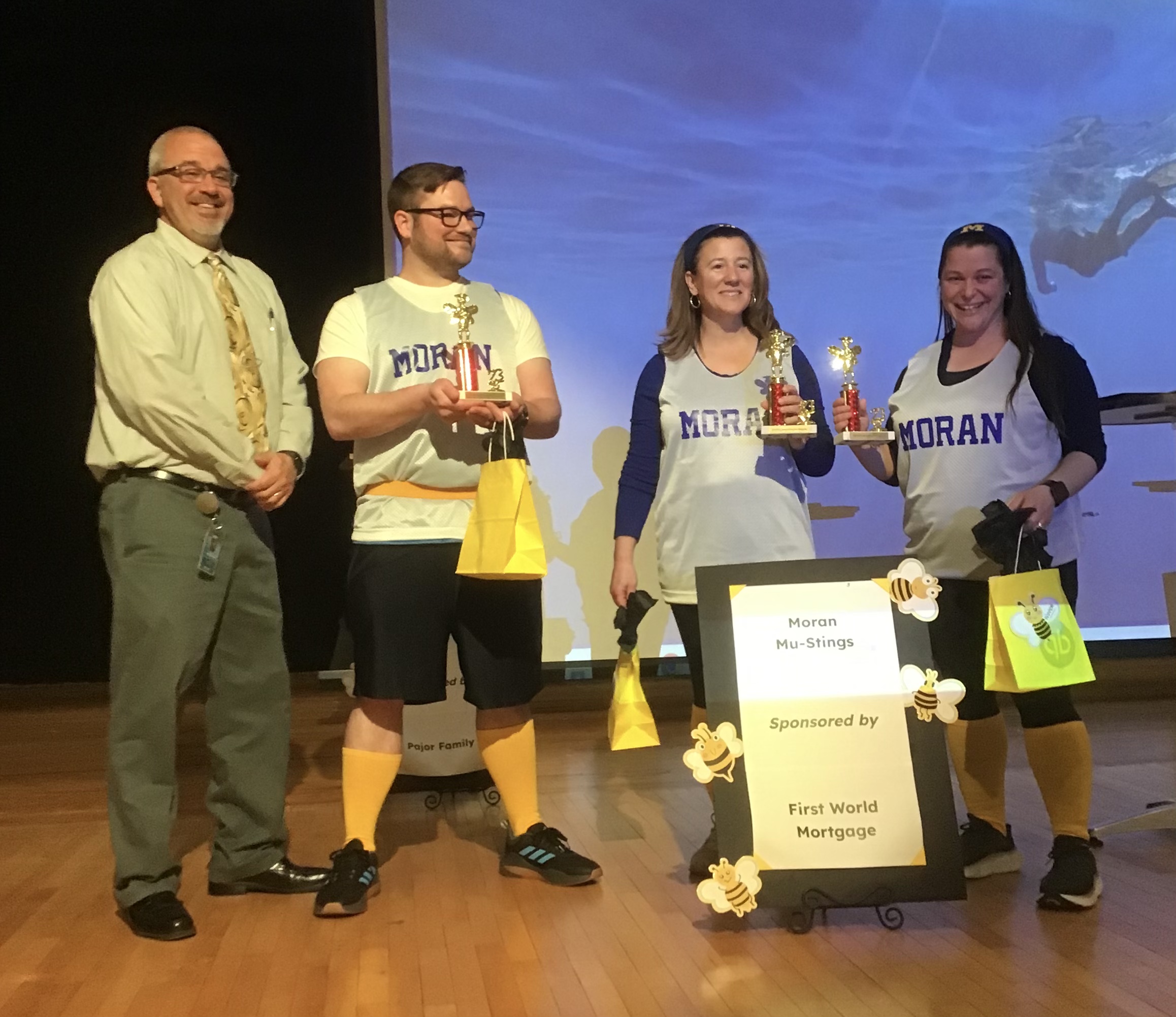 Spelling Bee Team Challenge winners with their proud principal.